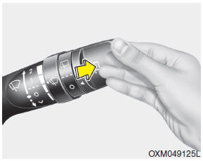 Push the lever away from you to spray rear washer fluid and to run the rear wipers