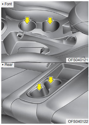 Cups or small beverage cans may be placed in the cup holders.